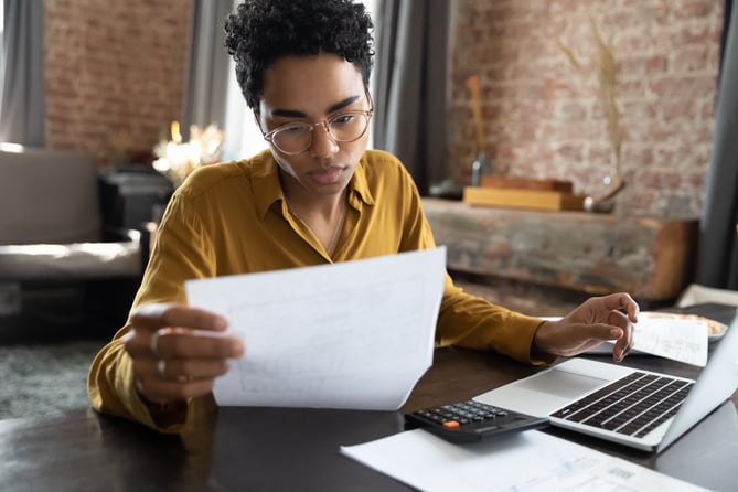 EquityZen overview of option agreement with woman reviewing paperwork with laptop